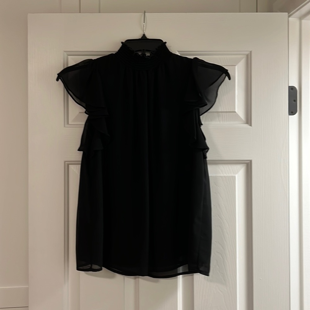 Black sleeveless blouse with ruffle sleeves